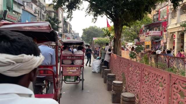 Busy Cycle Rickshaws and Crowds in Old Delhi Chandni Chowk Market