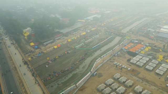 High Angle Aerial View of Crowded Tent City and Bridge