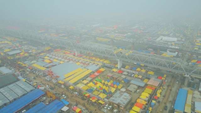 Aerial Shot of Kumbh Mela Tent City and Bridge in Fog