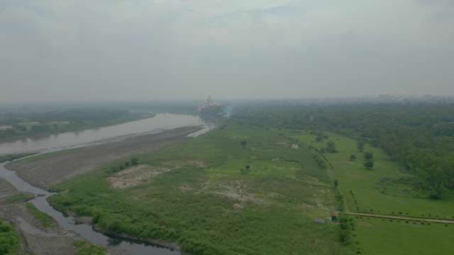 Distant Aerial View of Taj Mahal and Yamuna River in Fog