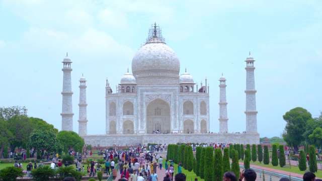 Iconic Taj Mahal Mausoleum and Gardens with Tourists in Agra India