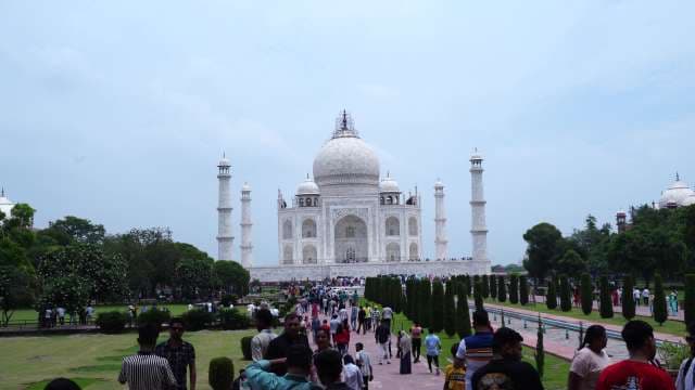 Crowds of Tourists Visiting Taj Mahal Landmark in Agra India