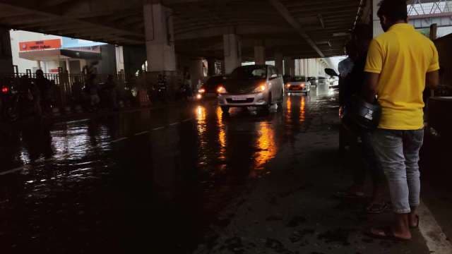 Rainy Night Traffic Under Bridge in Kolkata India
