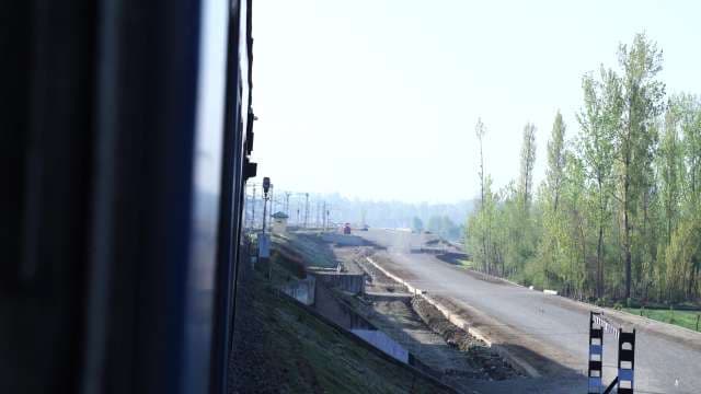 Rural Landscape and Railway Infrastructure View from Train Window