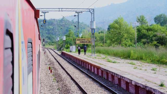 Red Train Passing Ramnagar Railway Station in Jammu and Kashmir