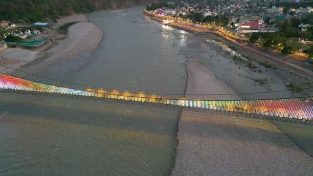Aerial View of Illuminated Rainbow Bridge Over Ganges River in Rishikesh