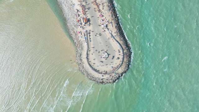 Aerial View of Coastal Pier and Turquoise Ocean