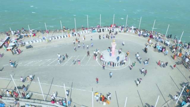 Aerial View of Crowded Coastal Plaza and Monument in India
