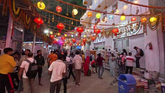 Crowded Festive Street with Colorful Lanterns at Indian Pilgrimage Site