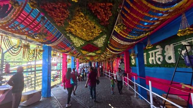 Vibrant Floral Decorations in an Indian Temple Walkway