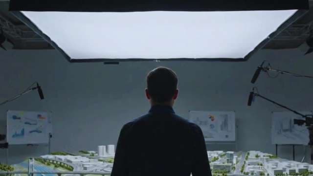 Architect Viewing Detailed Urban City Model in Studio Environment
