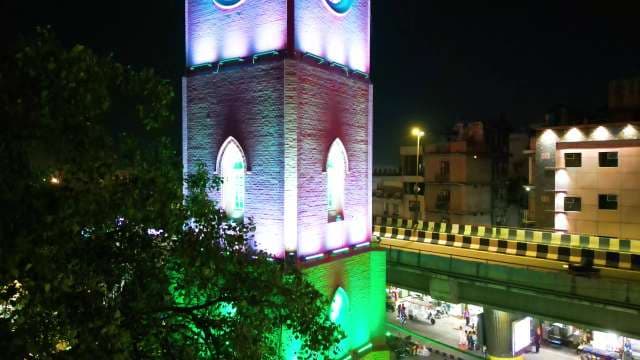 Colorful Illuminated Clock Tower in Urban Nightscape Ludhiana