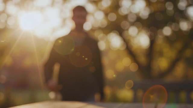 Abstract Blurred Silhouette of Man in Golden Hour Sun