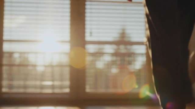 Cinematic Golden Hour Sunlight Streaming Through Window Blinds
