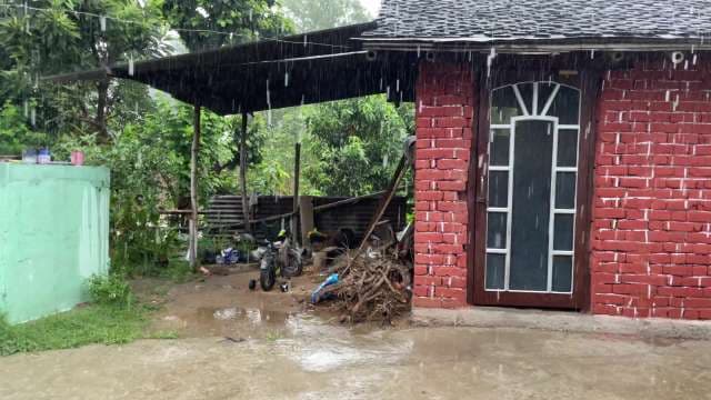 Heavy Rain Falling on Rural Red Brick House