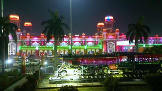 Illuminated Lucknow Charbagh Railway Station and Vintage Locomotive at Night