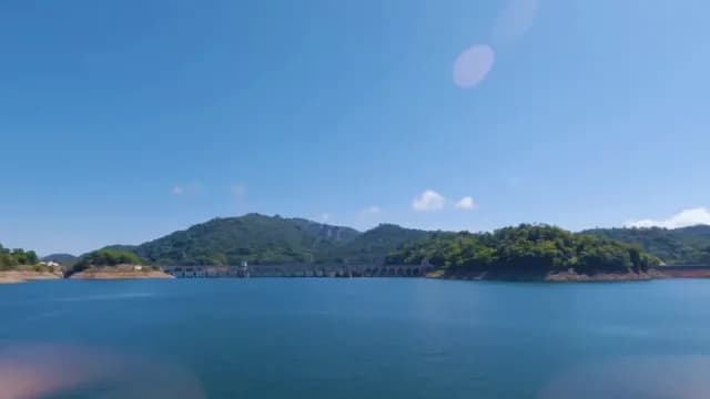 Wide View of Scenic Mountain Dam and Reservoir