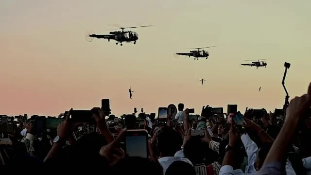 Indian Navy Helicopters Perform Aerial Stunts for Crowd at Sunset in Navi Mumbai