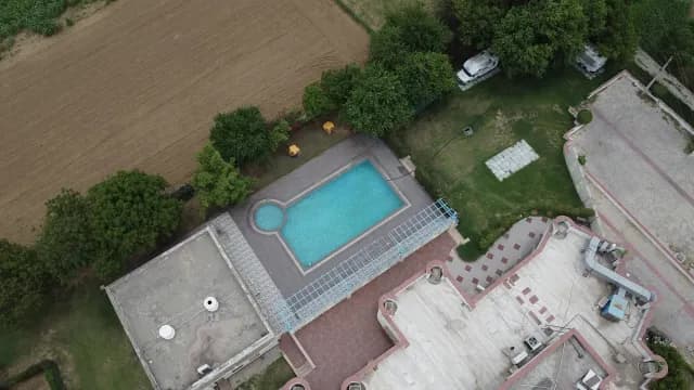 Aerial View of Private Resort Pool and Lush Green Landscape