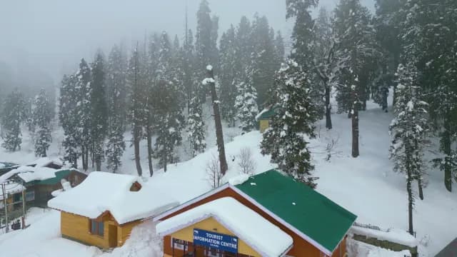 Snowy Gulmarg Tourist Information Centre Amid Misty Winter Forest