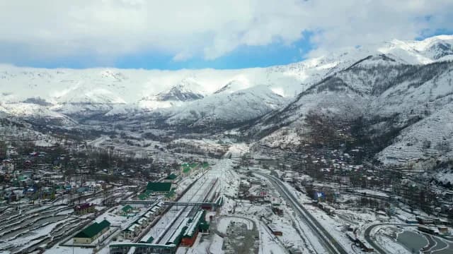 Aerial View of Snowy Kashmir Valley and Railway Infrastructure