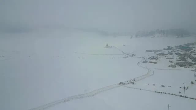 Aerial View of Snowy Gulmarg Valley in Thick Winter Fog
