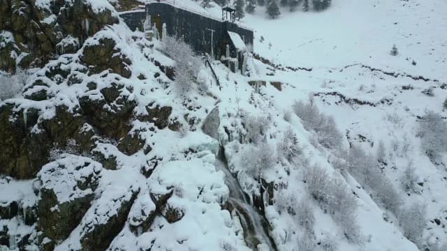 Frozen Mountain Waterfall and Snow-Covered Rocky Cliffs in Srinagar