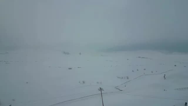 Aerial View of Foggy Snow Covered Valley in Gulmarg