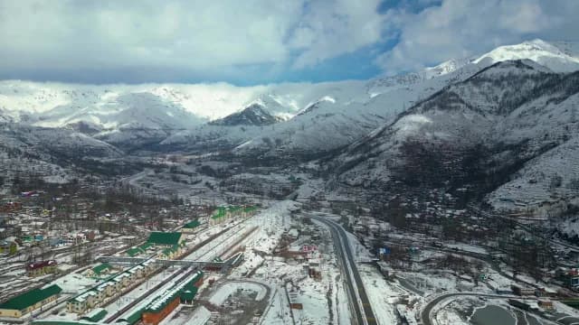 Aerial View of Snowy Srinagar Valley Town and Railway Station