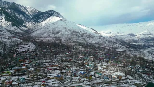 Aerial View of Snowy Himalayan Village in Winter