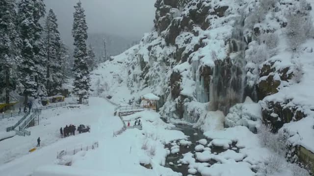 Frozen Waterfall Cascading Down Snowy Kashmir Mountain Cliffs