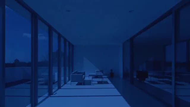 Modern Minimalist Interior with Blue Night Lighting and Glass Walls