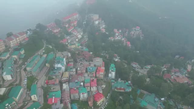 Aerial View of Misty Shimla Hill Station with Colorful Rooftops