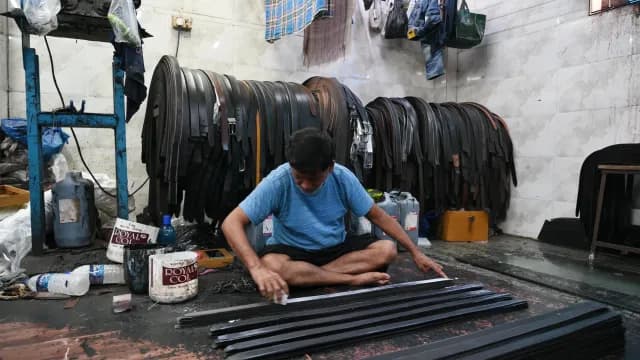 Artisan Handcrafting Leather Belts in a Traditional Workshop