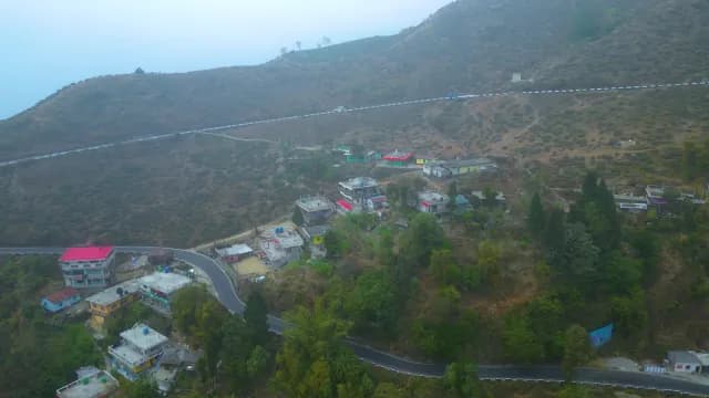 Aerial View of Misty Mountain Village and Winding Road, Darjeeling