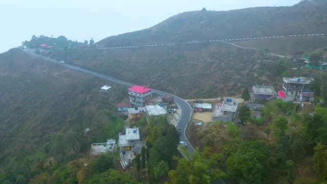Aerial View of Winding Mountain Road and Hillside Village in Darjeeling