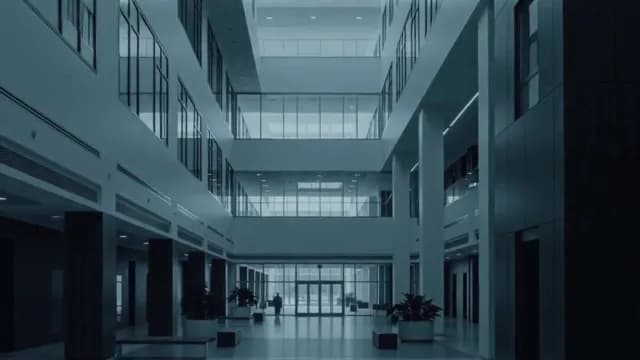 Modern Corporate Atrium with Minimalist Glass Architecture and Blue Lighting