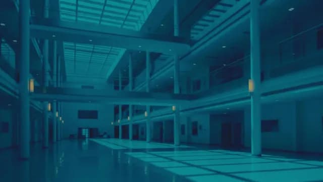 Modern Multi-Story Corporate Atrium Interior with Blue Lighting