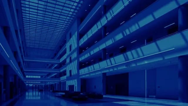 Modern Corporate Building Interior Atrium with Blue Lighting