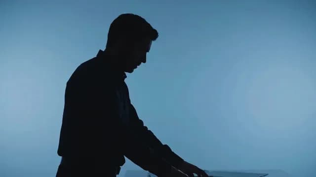 Silhouette of Focused Businessman Working at Desk
