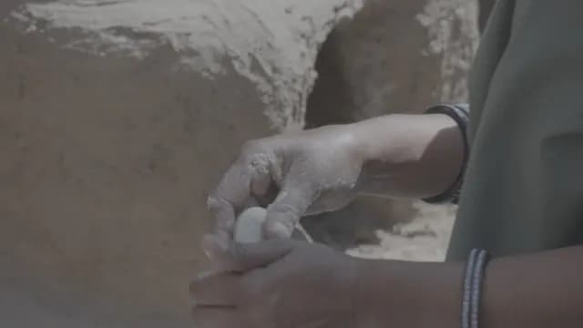 Traditional Rajasthan Woman Making Chapati On Chulha
