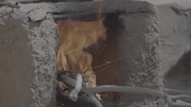 Close-Up of Traditional Mud Stove Burning Wood, Rajasthan
