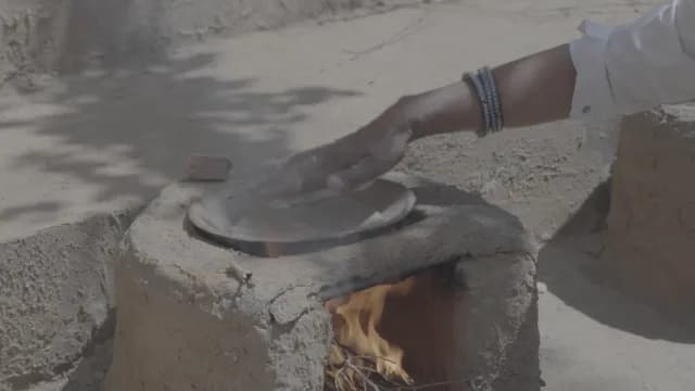 Traditional Roti Cooking on Outdoor Clay Stove in Rural Rajasthan