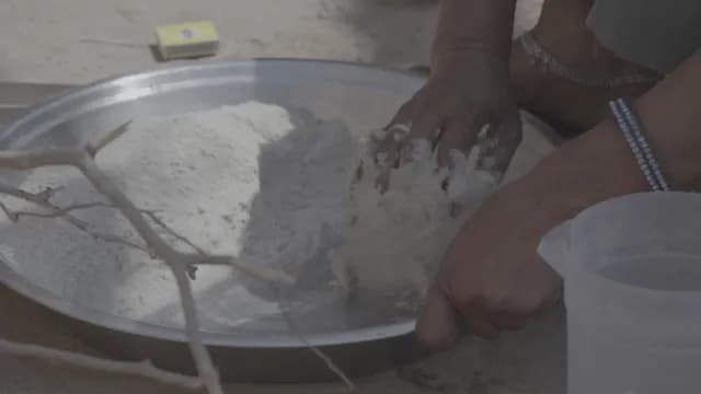 Woman Kneading Dough Traditionally in Rural Rajasthan