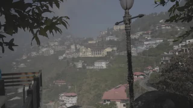 Scenic Foggy View of Mussoorie Hill Station Architecture and Mountains