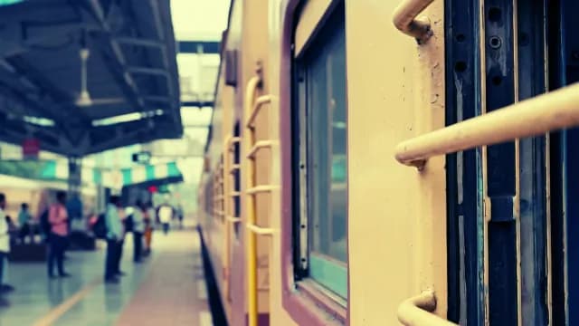 Indian Passenger Train at Busy Railway Station Platform
