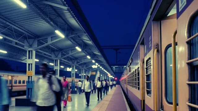 Busy Indian Railway Platform at Night with Commuters