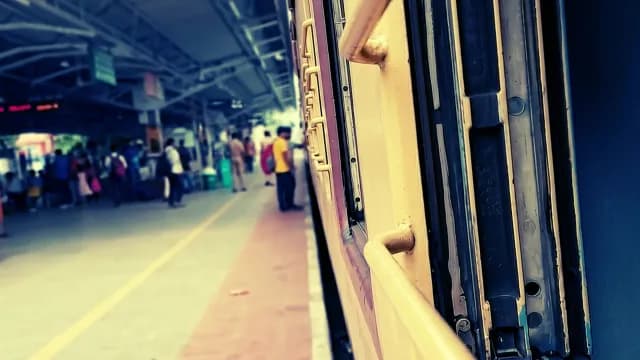 Indian Railway Train Stopped at Busy Station Platform