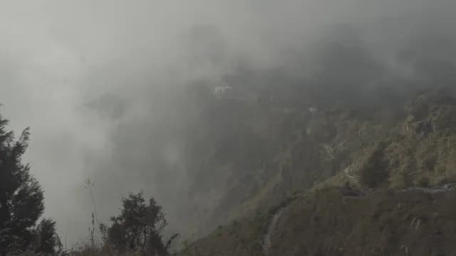 Atmospheric Mist Over Steep Forested Mountain Ridges in Mussoorie