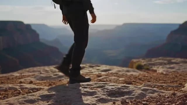 Hiker Walking Towards the Edge of the Grand Canyon